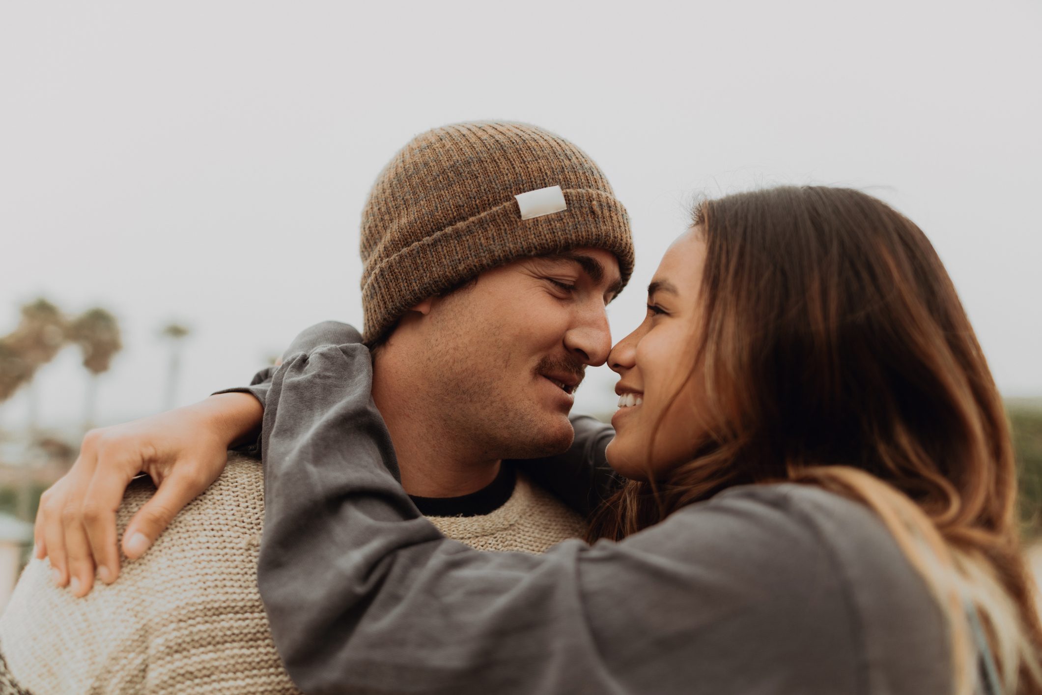 young couple smiling and embracing each other