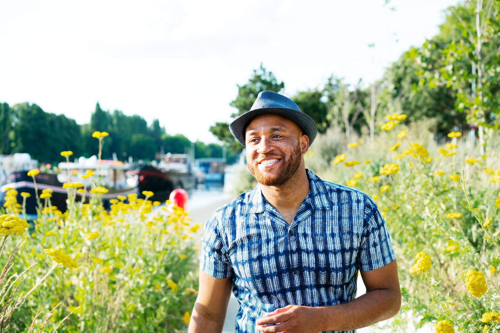 smiling man outside on a summer day
