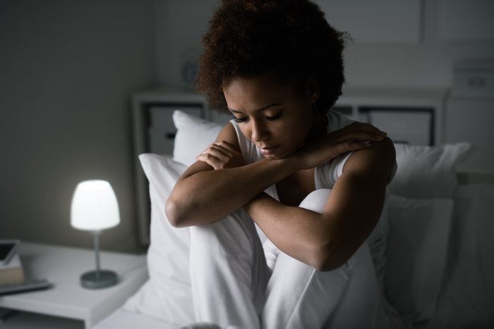 Depressed woman in her bed