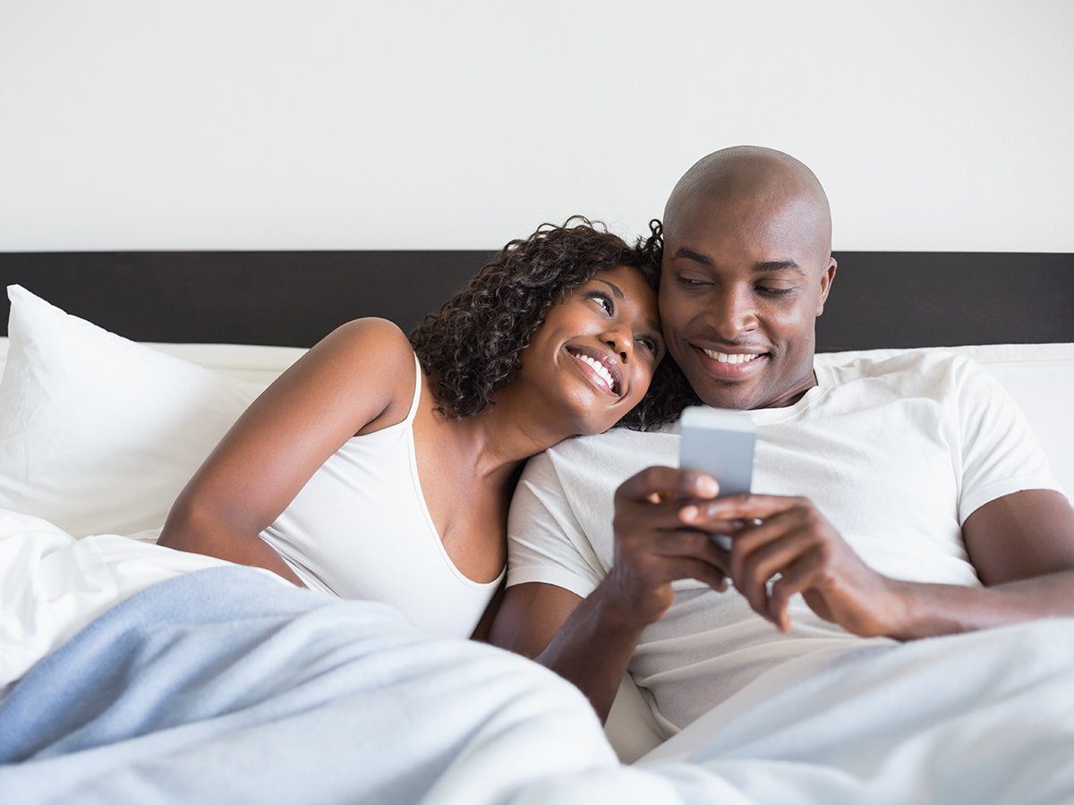 happy couple in bed