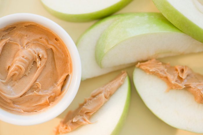 Peanut butter on sliced apple