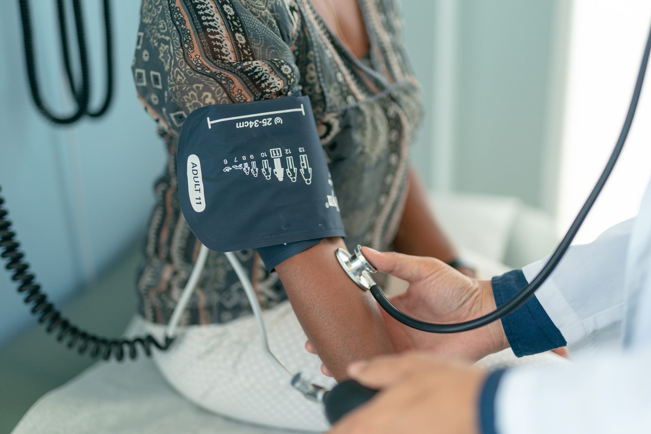 woman having blood pressure taken