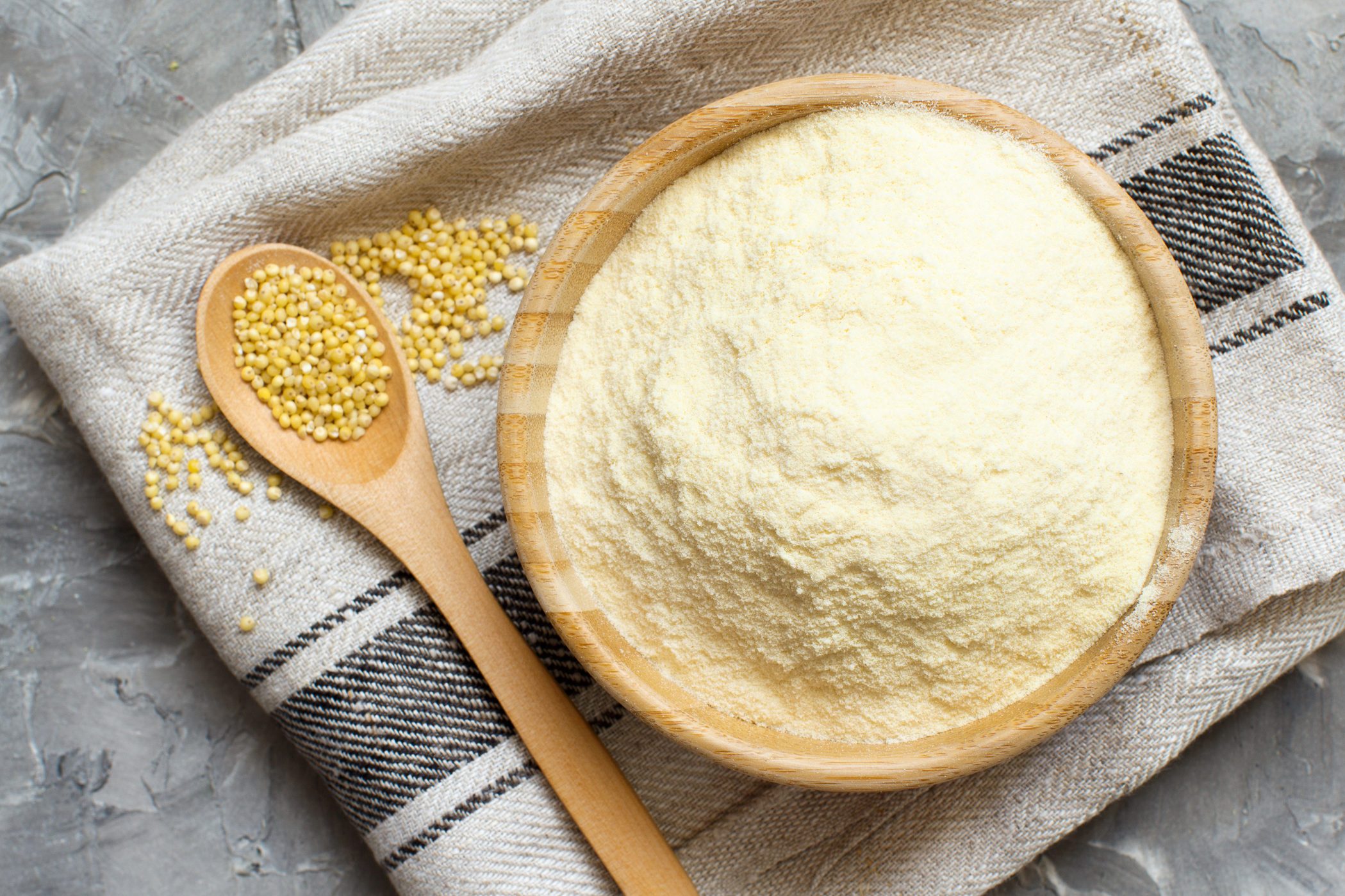 Hulled millet flour and grain top view