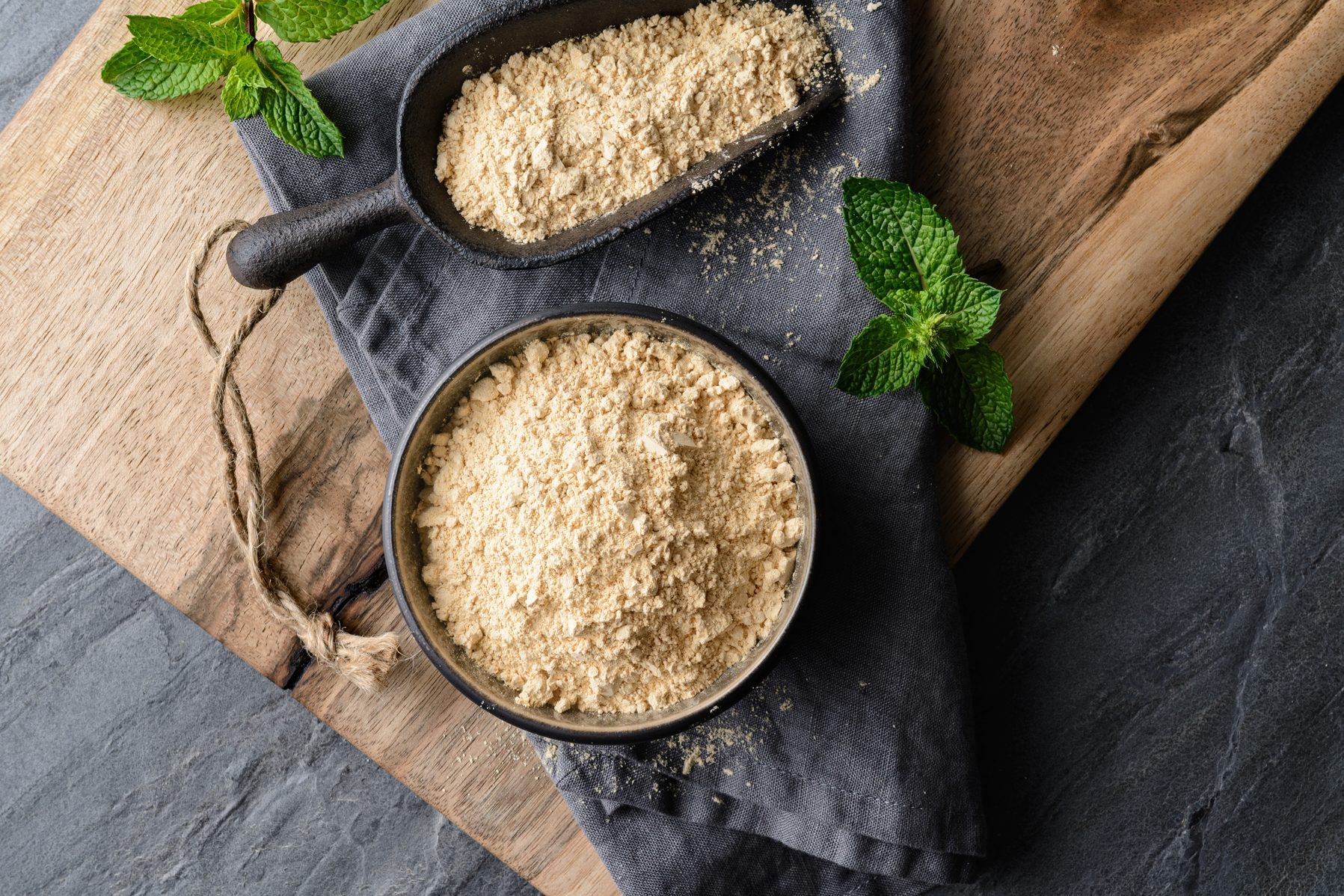Dietary supplement, Maca root powder in a bowl and scoop with copy space