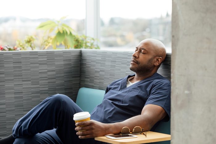 Male nurse taking a moment to relax