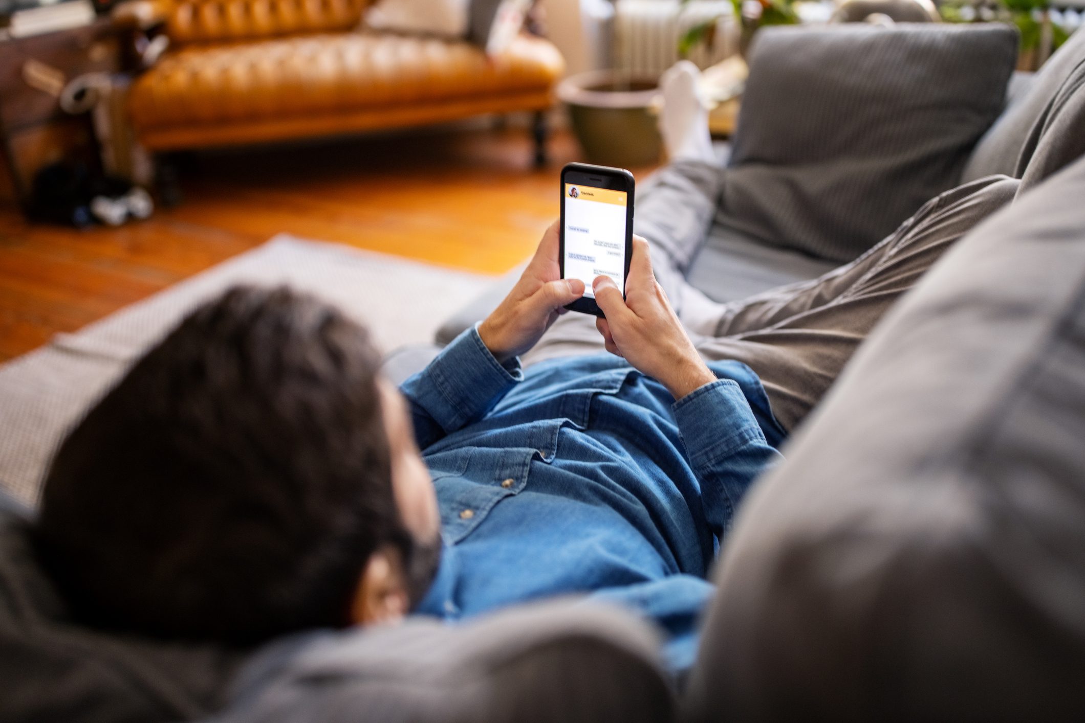 Man chatting with friend on messaging app