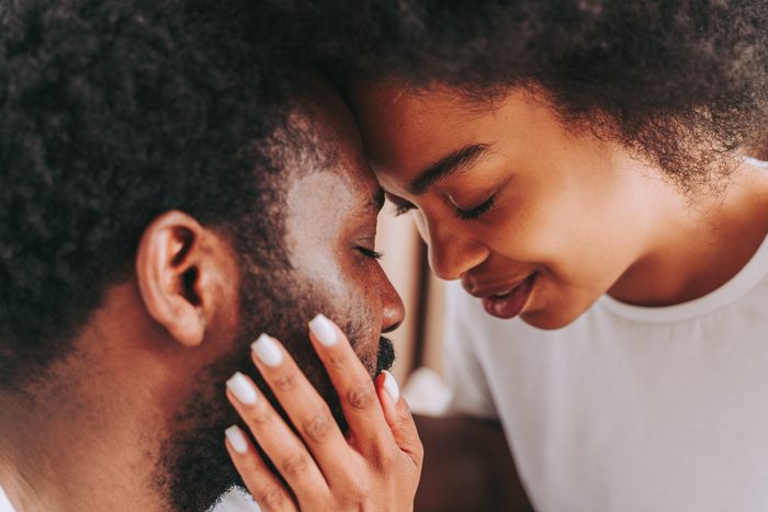 Close-Up Portrait Of Couple Kissing