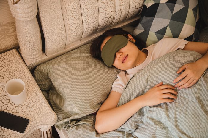 asian woman sleeping on bed in the morning