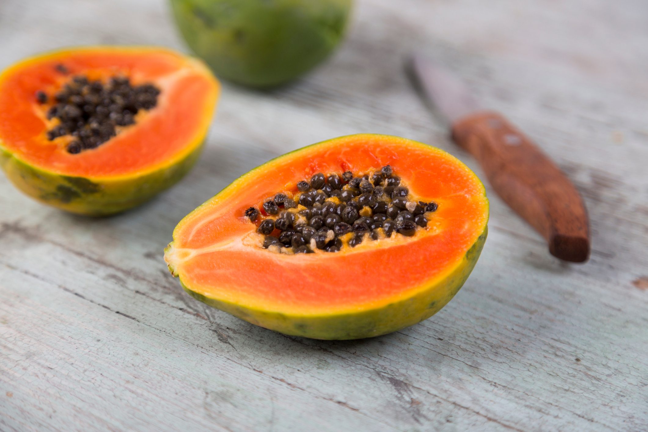 Sliced papaya on wood