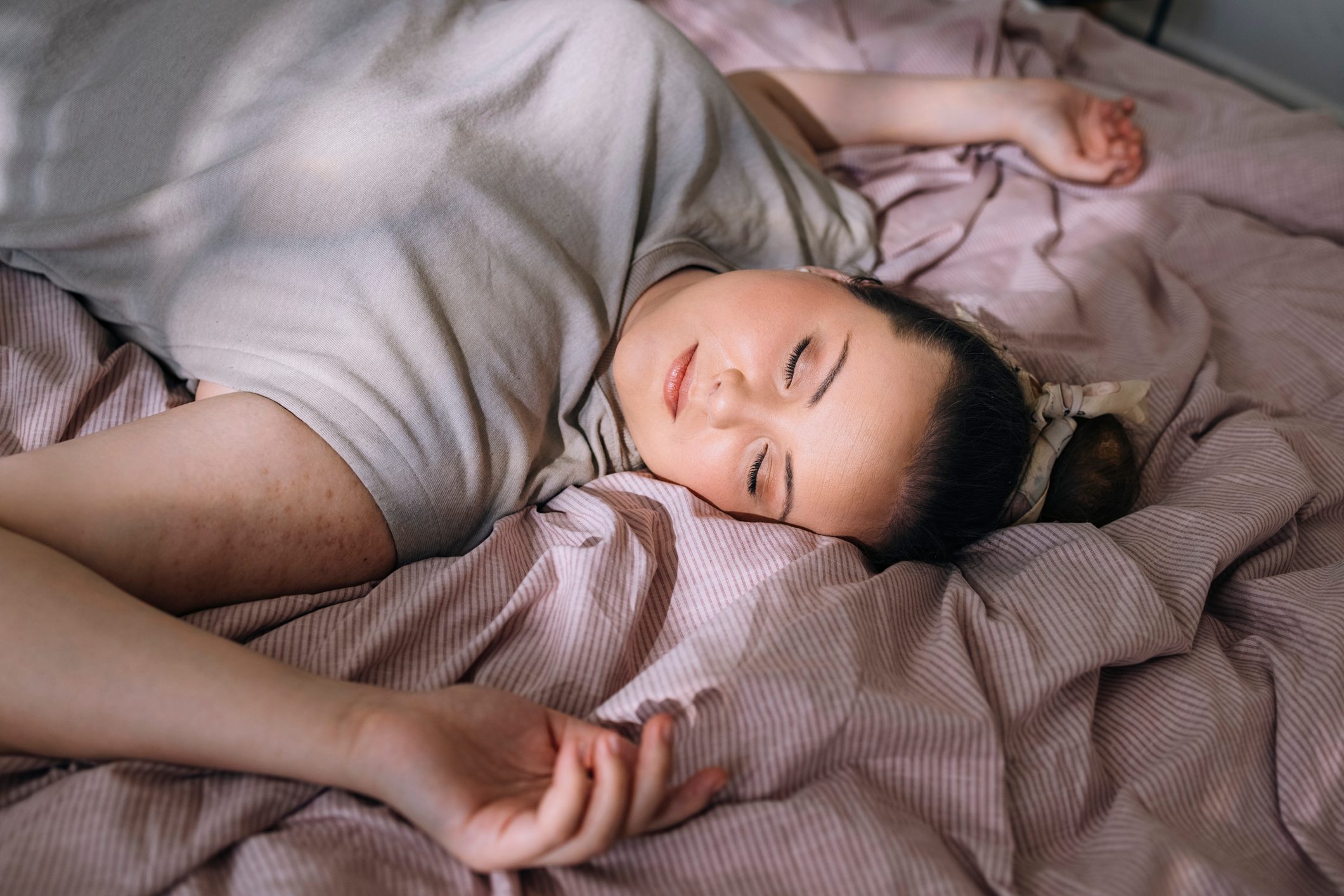 woman laying on bed