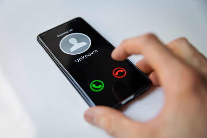 smartphone with incoming call from unknown person