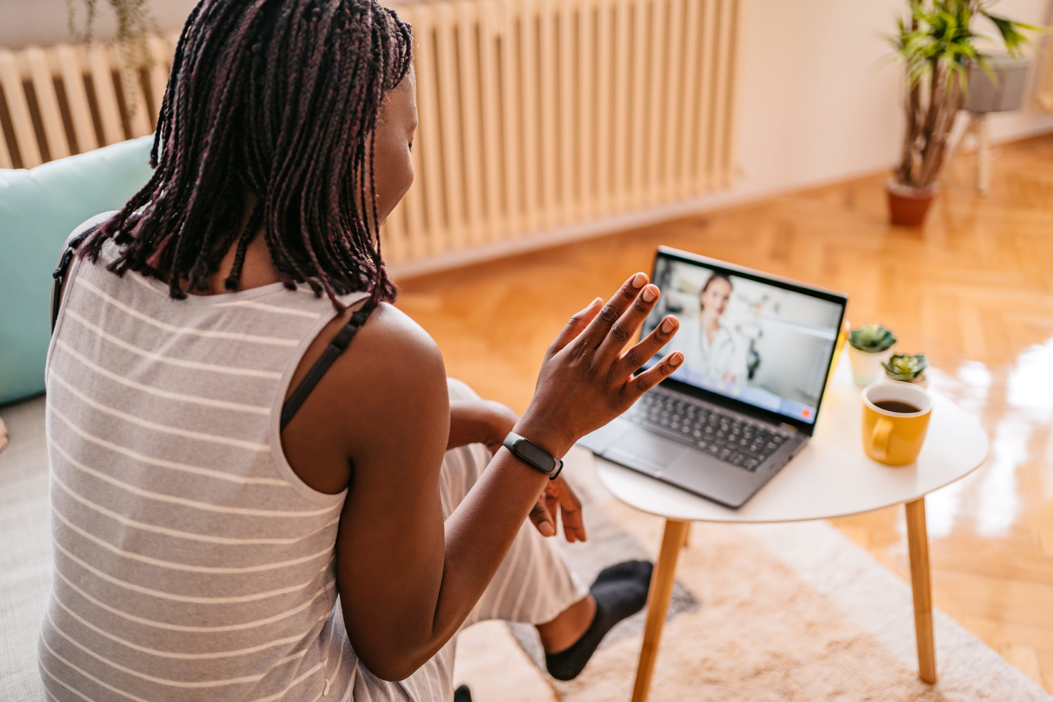 Woman Video Conferencing With Doctor On phone
