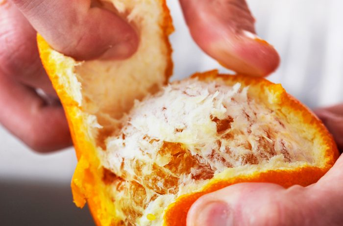 Man pealing fruit
