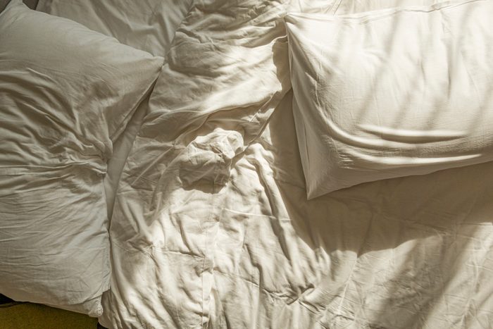 Messy White Sheet On Bed