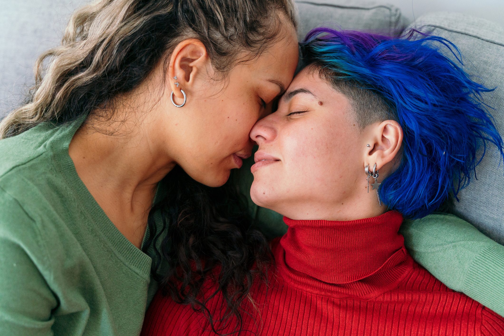 Close up of lesbian couple in love with valentine winter clothes