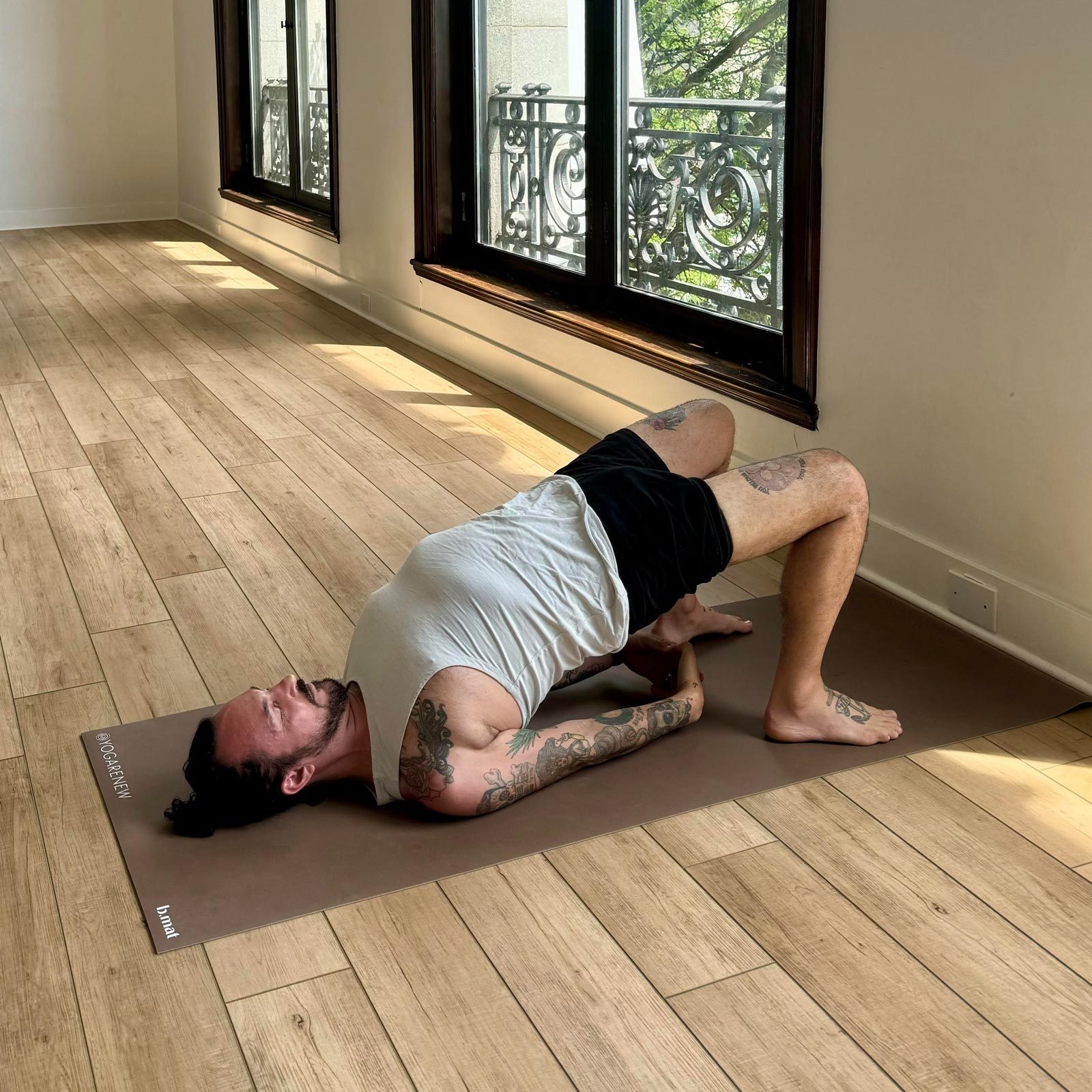 man doing Bridge yoga Pose
