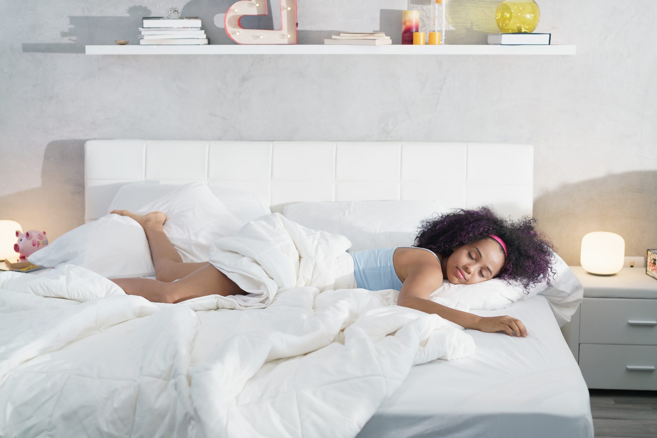 Woman Lying On Bed At Home