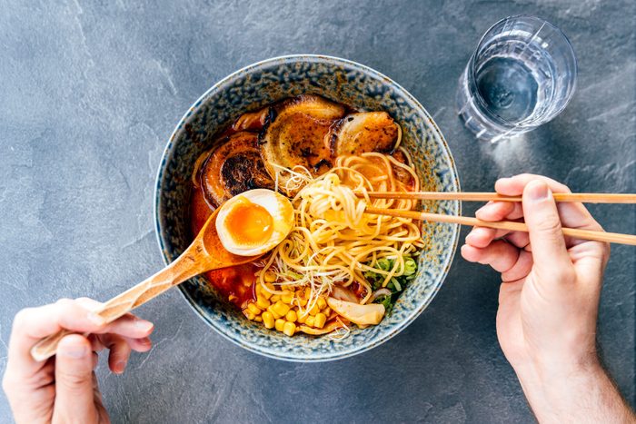 Man eating tonkotsu ramen