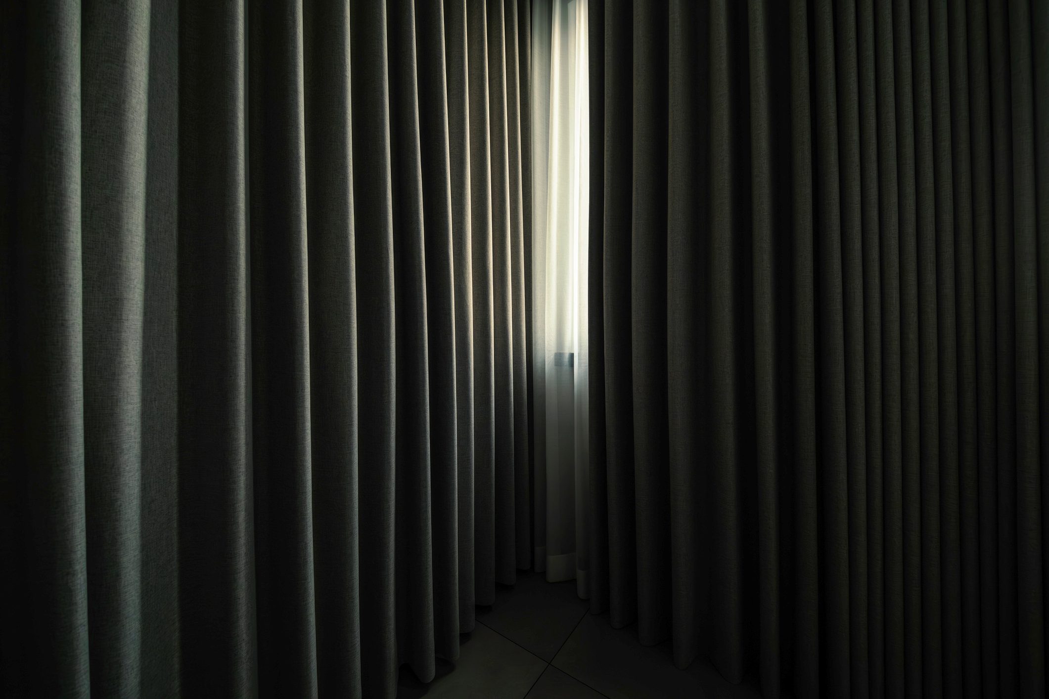 The light shining through the curtains