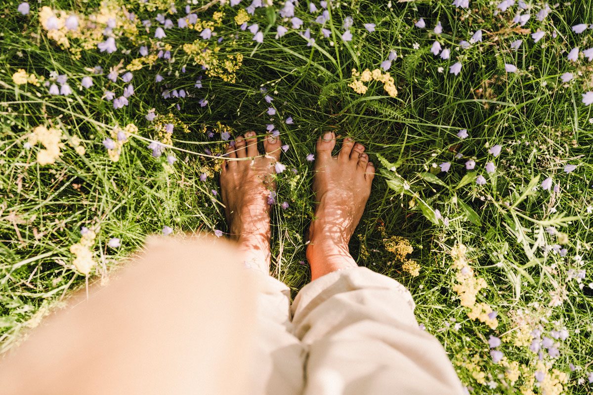 Barefoot Feet Grounding In Summer Grass Outdoors In Nature