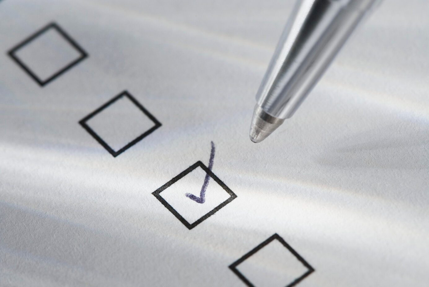 Still life of pen checking box