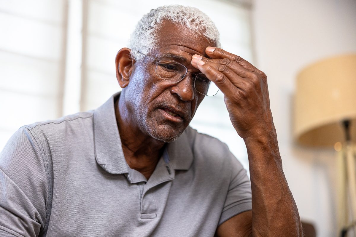 senior black man with headache