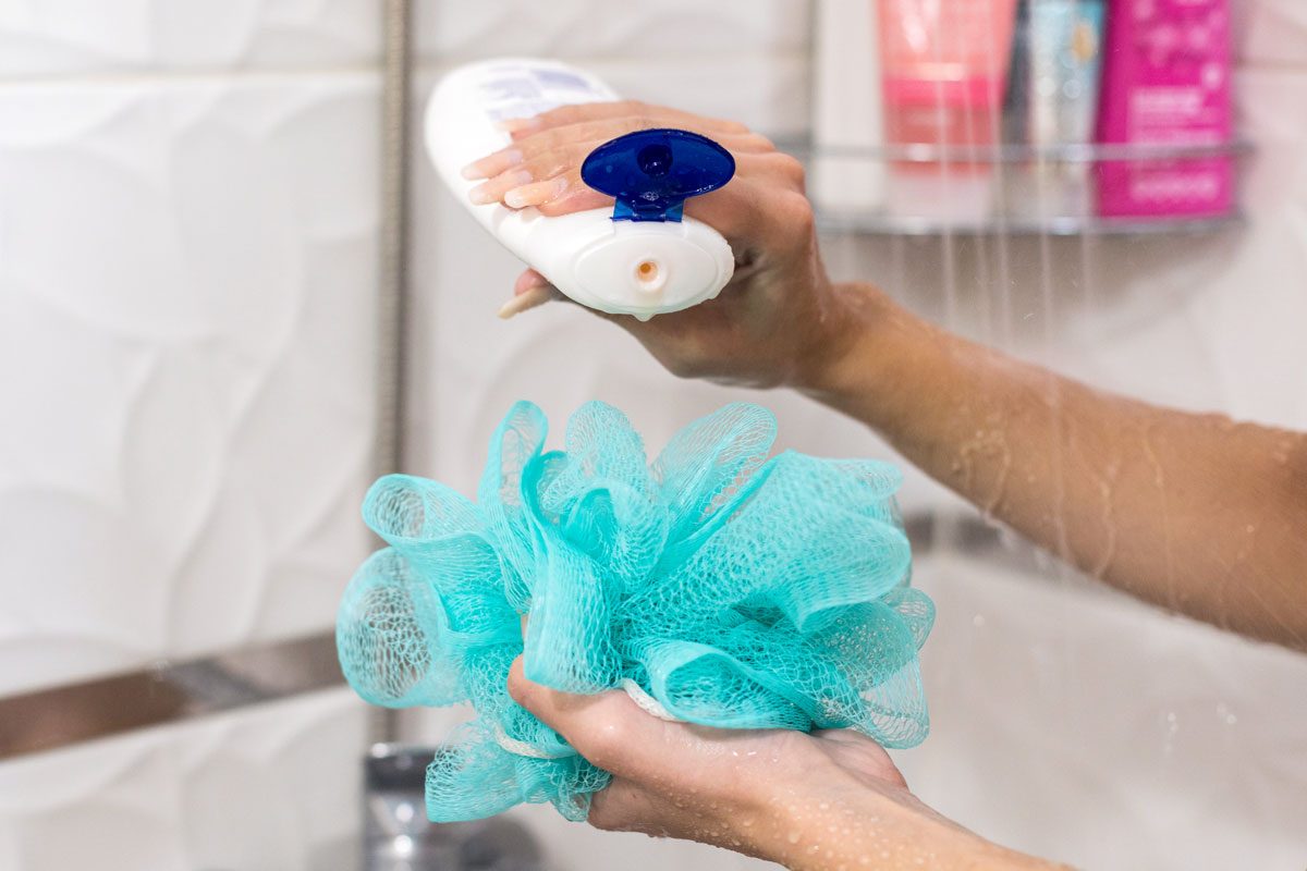 Woman Applying Shower Gel