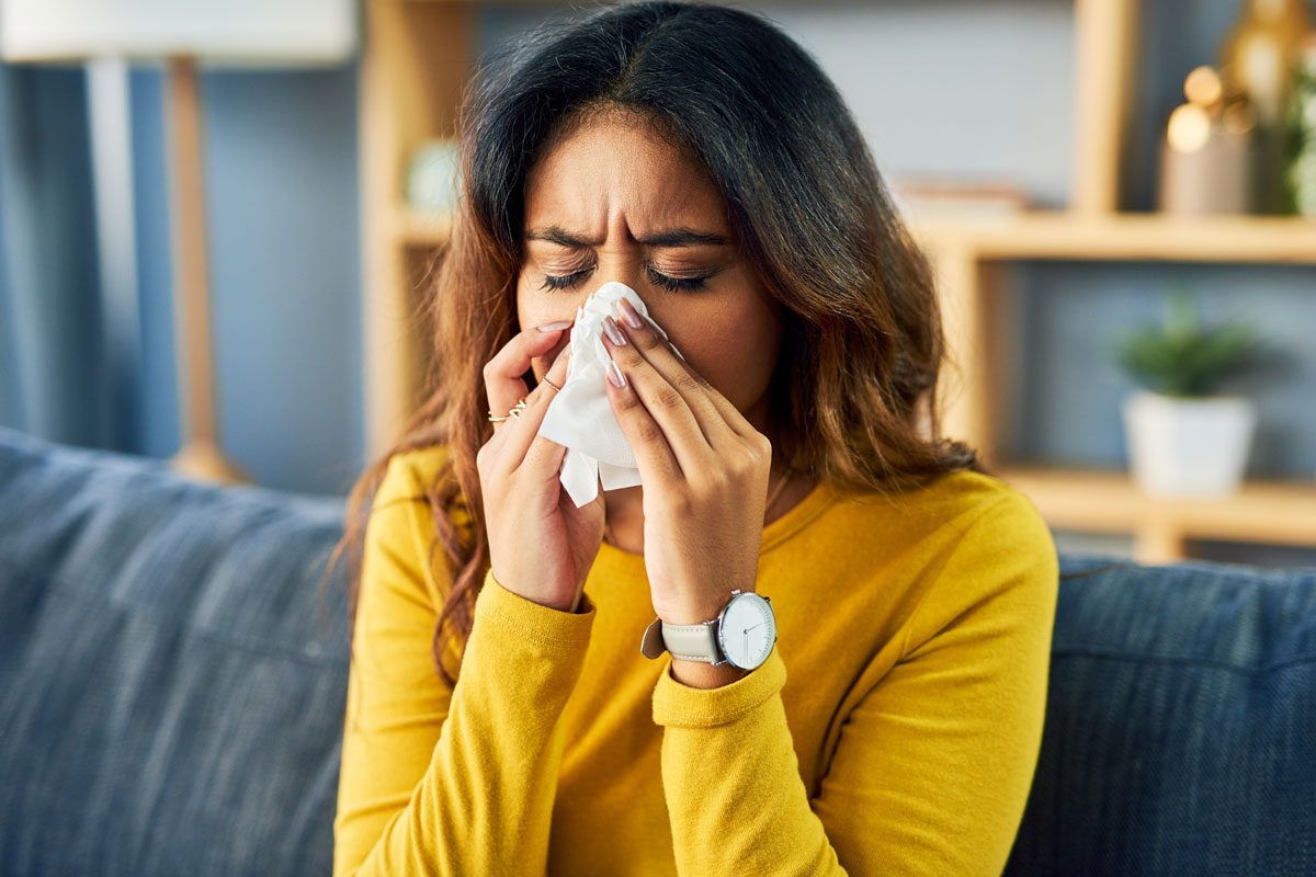 Young Woman Sneezing