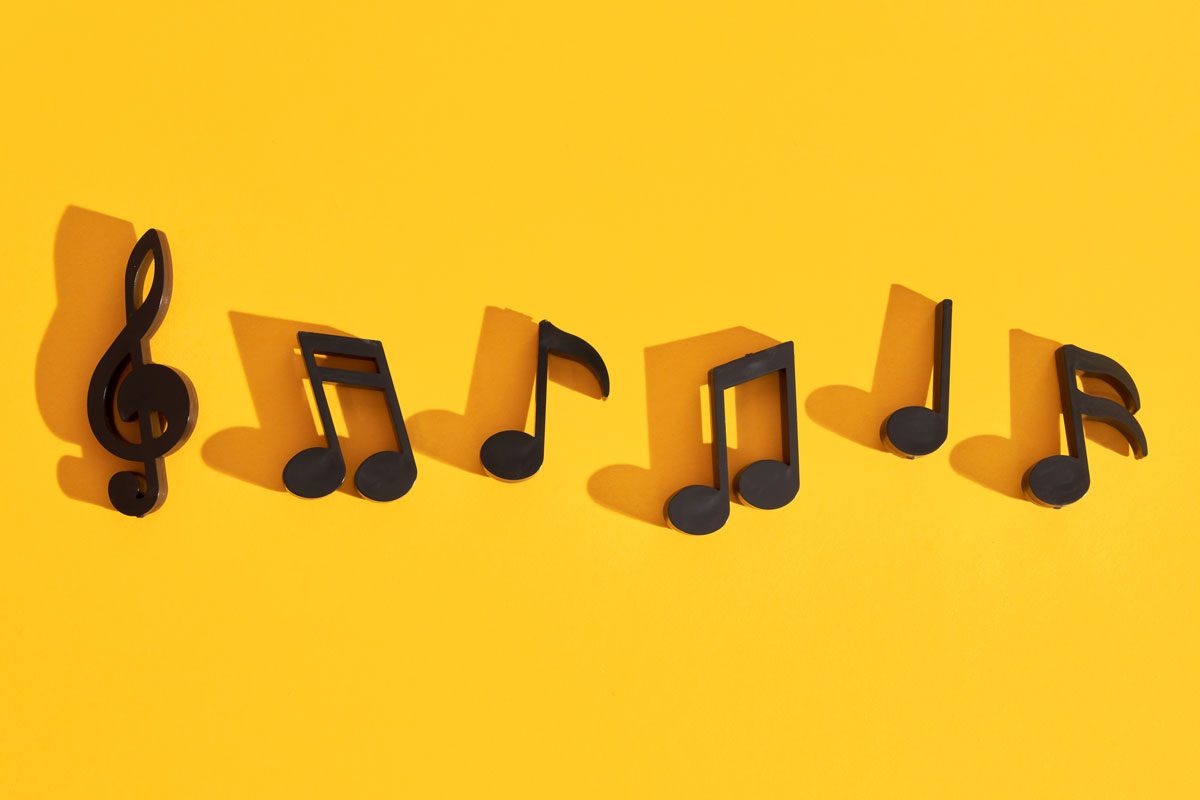 Musical Notes On Yellow Background