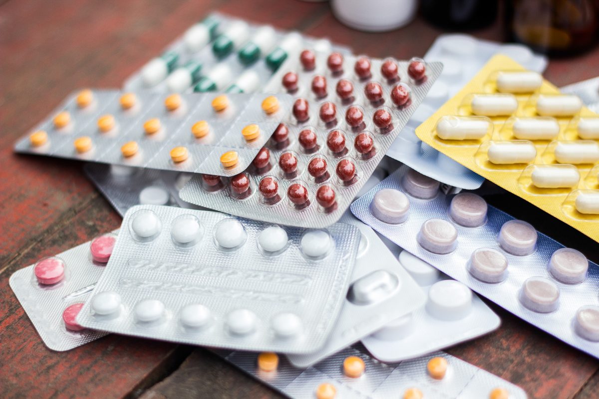medicines on wooden table
