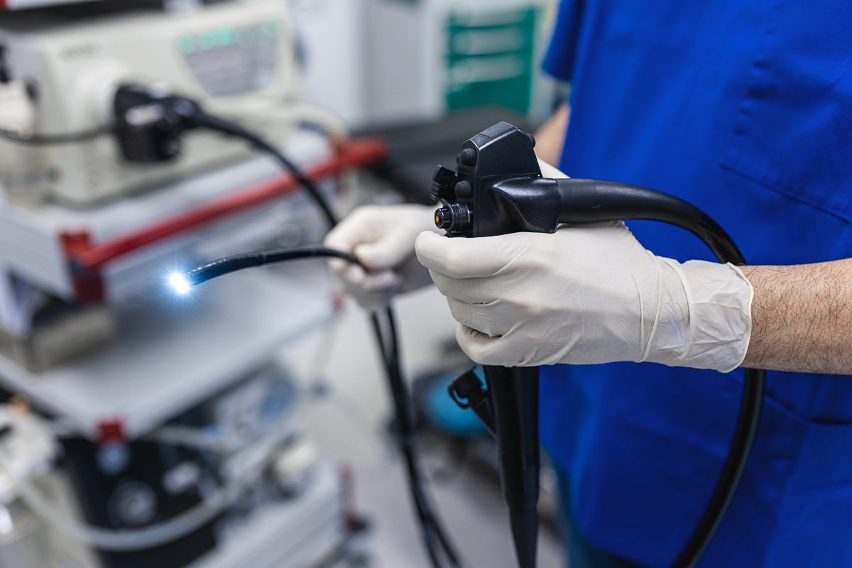 doctor holding colonoscopy equipment